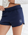 Your favorite minimalistic cotton shorts for fall/spring. can be worn at the beach, coffee run at the city or to lounge at home. Soft fabrication, elastic waistband with ripped cotton details. our DM logo on the bottom part of the shorts. Fit: Hits at the natural waistline, true to size, shorty-length. model wearing size s.