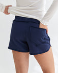 Your favorite minimalistic cotton shorts for fall/spring. can be worn at the beach, coffee run at the city or to lounge at home. Soft fabrication, elastic waistband with ripped cotton details. our DM logo on the bottom part of the shorts. Fit: Hits at the natural waistline, true to size, shorty-length. model wearing size s.